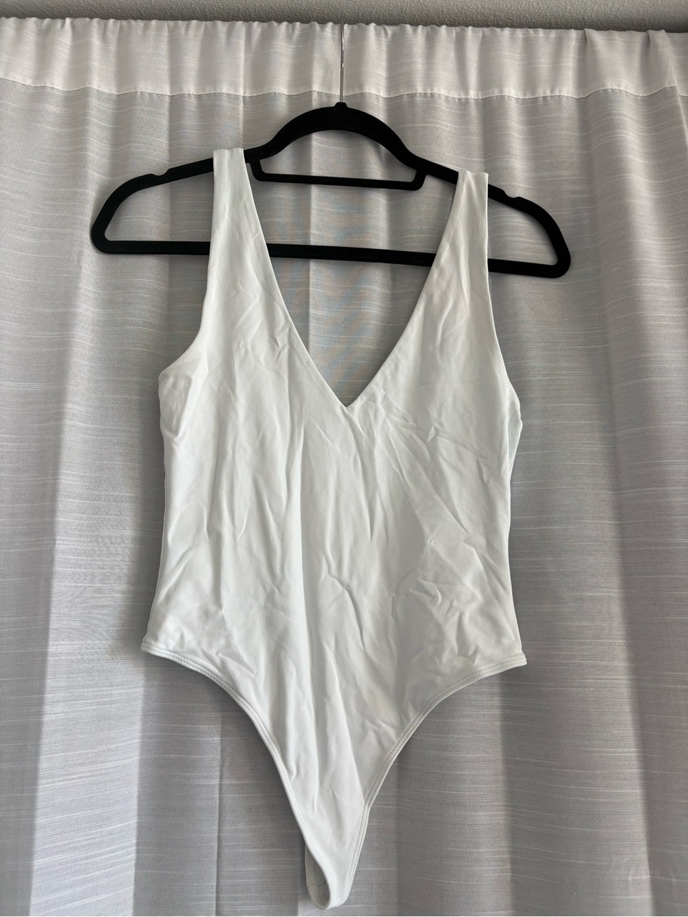 Babaton White V-Neck One-Piece Bodysuit